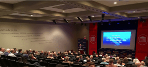 Harrington presenting at the opening of Day 2, ACT 6 Experience